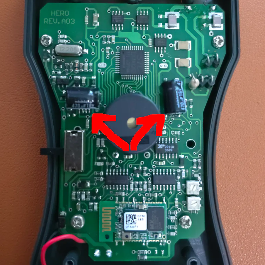 Rev.A03 shows two large capacitors